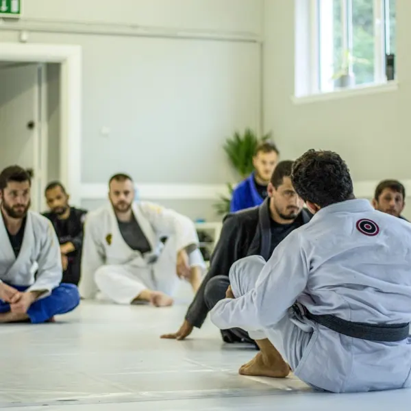 A Brazier Jiu Jitsu class watching a technique being demonstrated